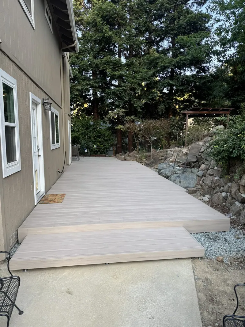 Composite deck steps at a back door
