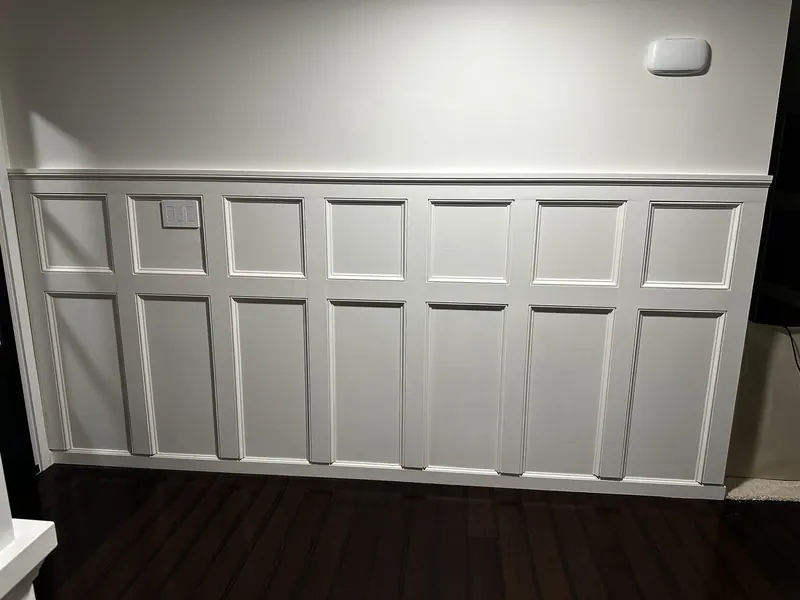 White board-and-batten wainscoting after painting